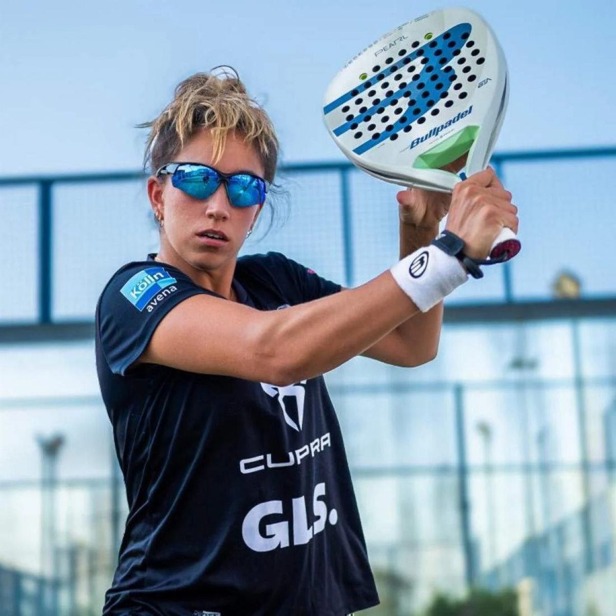 A folded view of the Addictive Pearl C1 Black Blue padel sunglasses, showing the black frame, blue lenses and compact sports design.