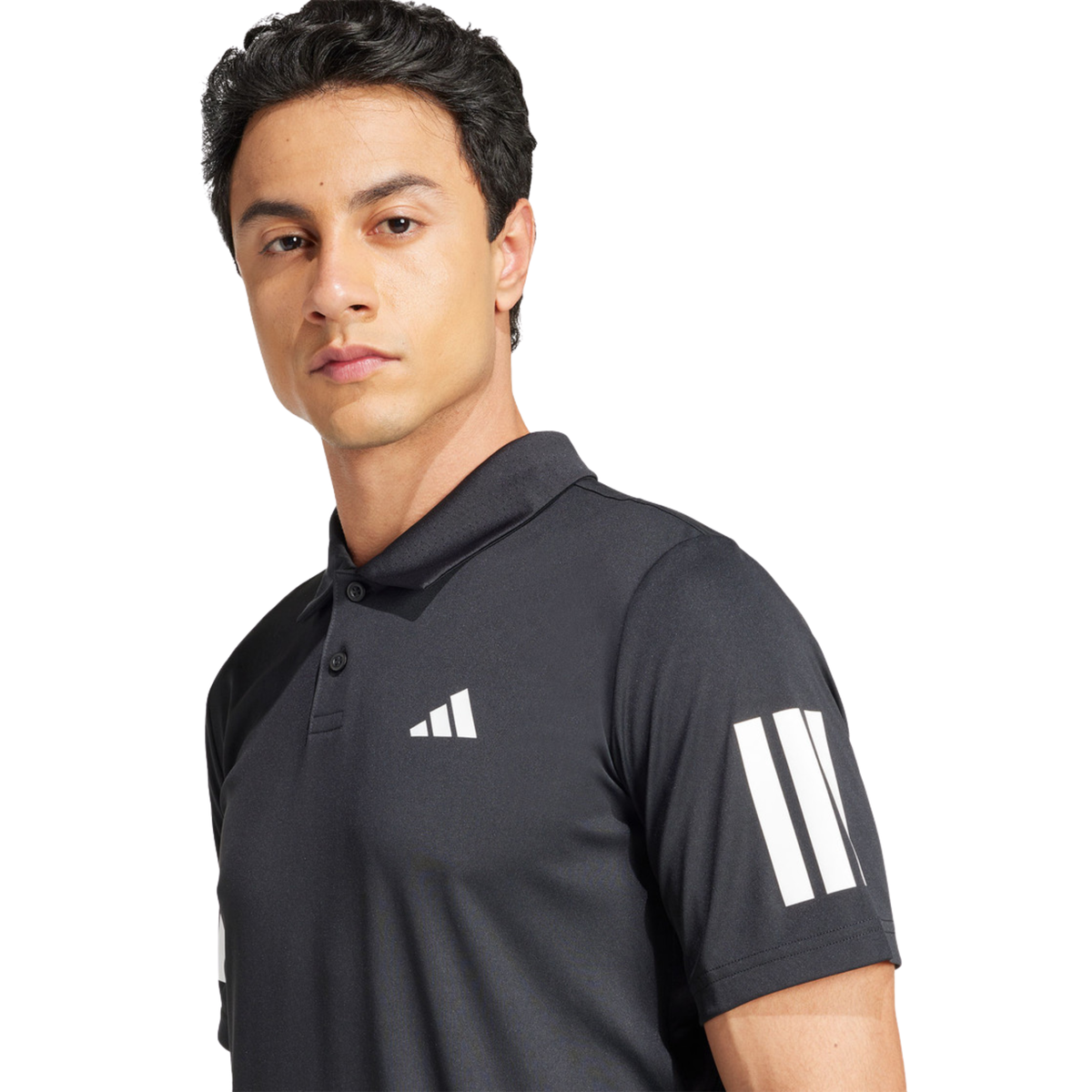 Close-up front view of a model wearing the black adidas polo shirt.