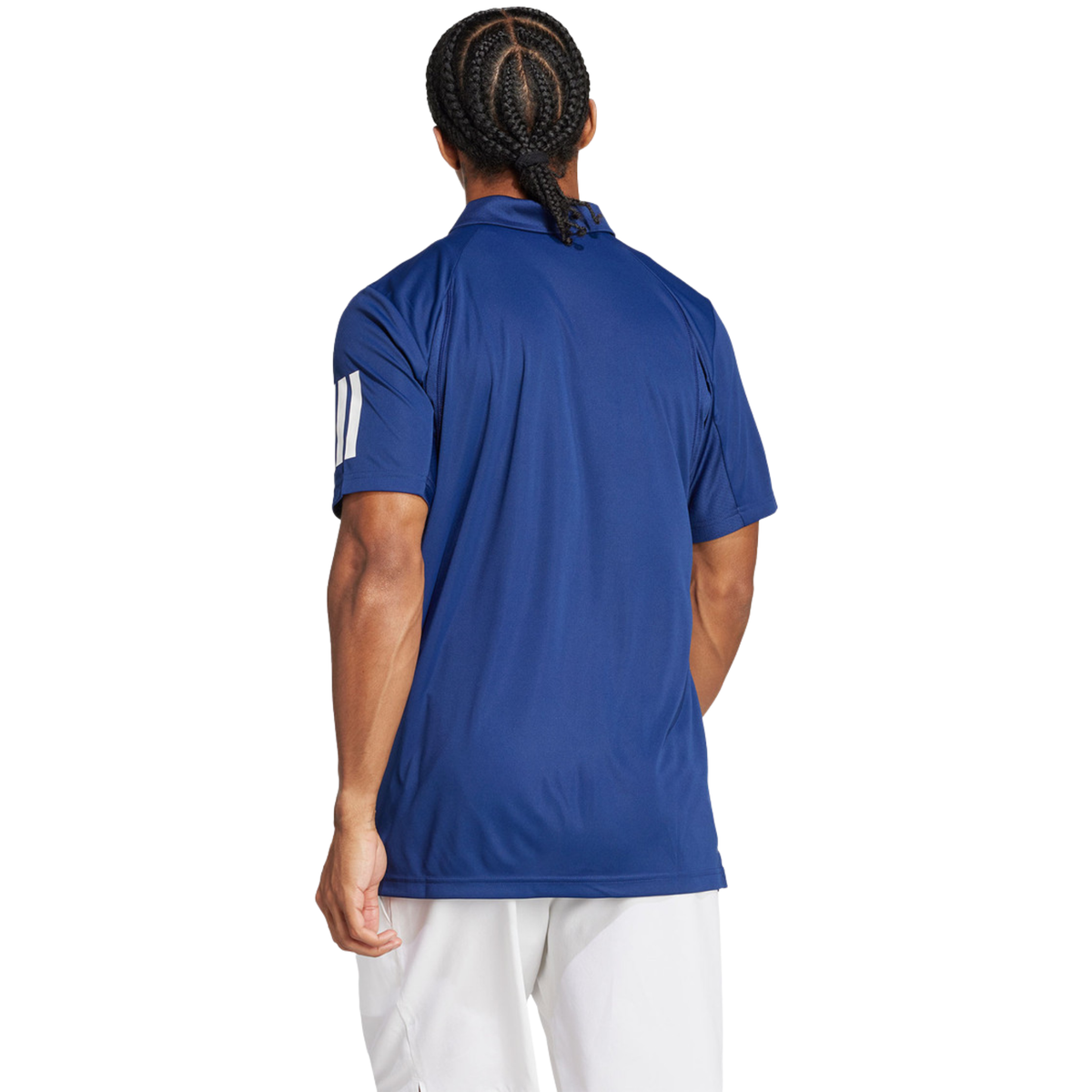 Back view of a model wearing the blue Adidas polo shirt.