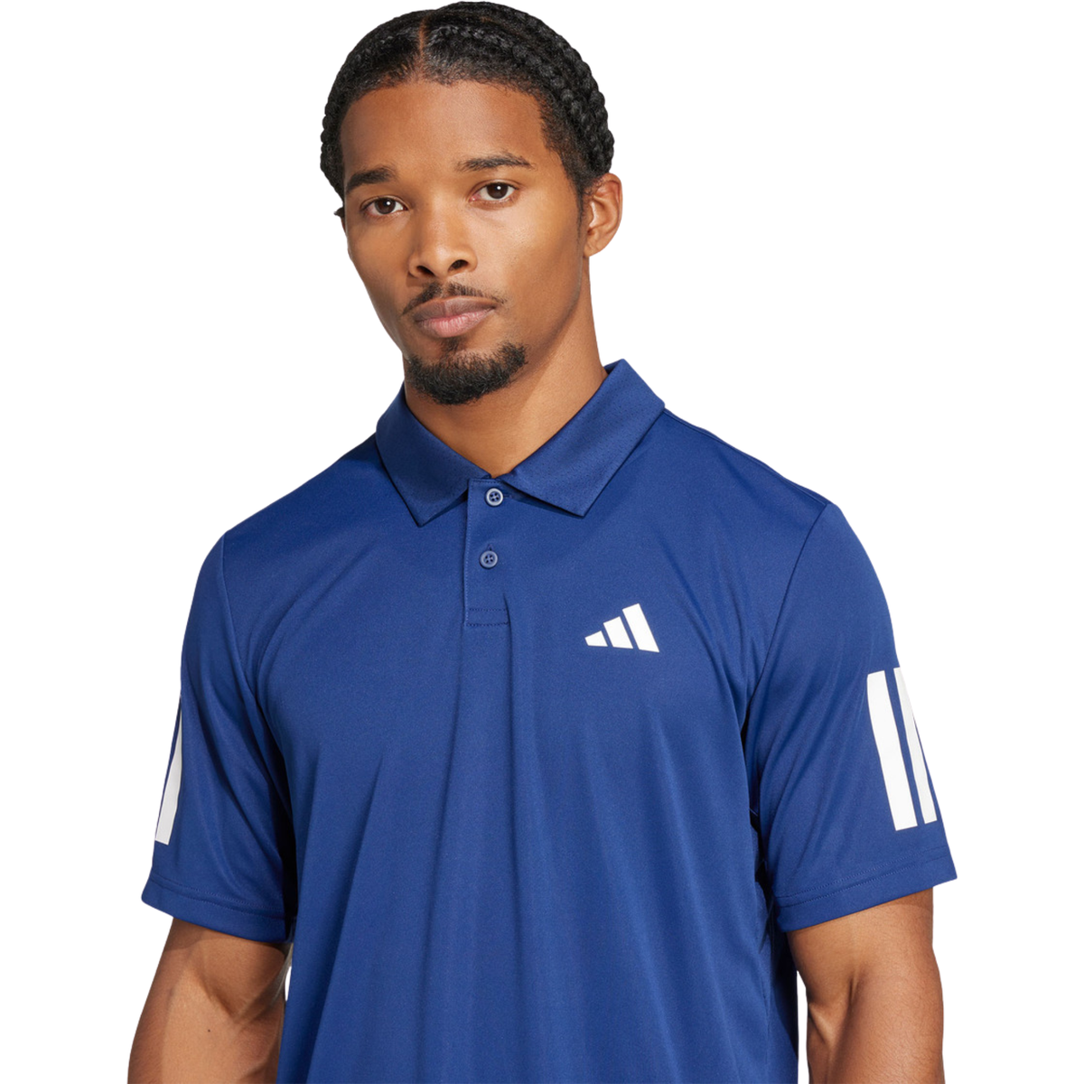 Close-up view of a model wearing the blue Adidas polo shirt.