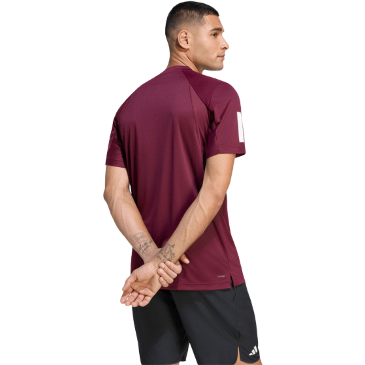 Back view of a model wearing the burgundy adidas T-shirt.