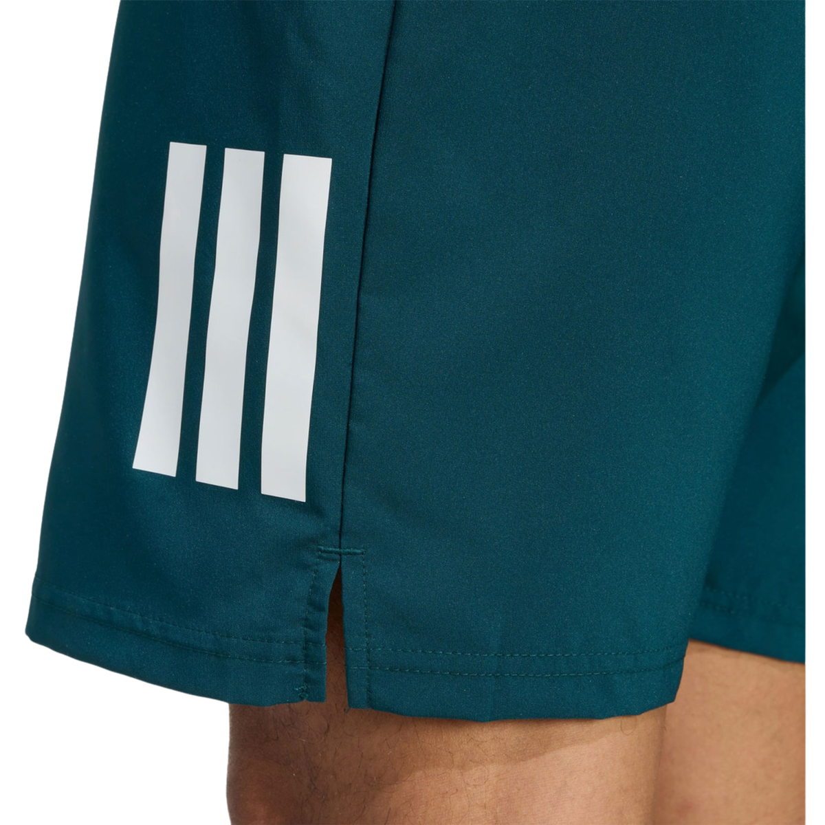 Close-up of the teal adidas men's shorts showing the white three-stripe detail and side slit.