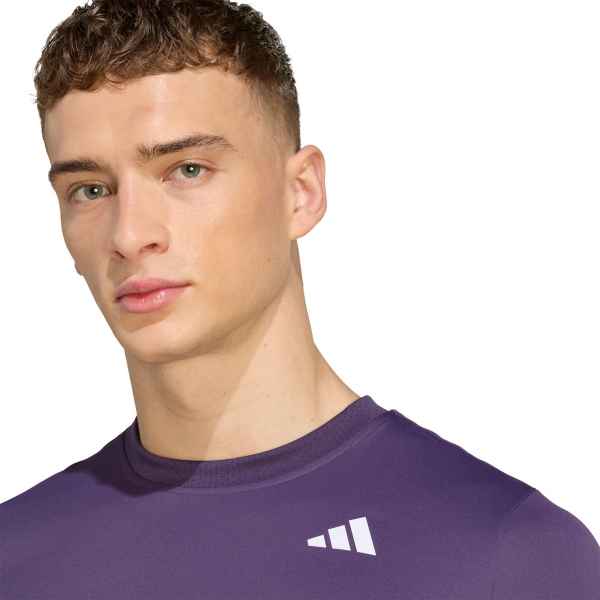 Close-up front view of the purple adidas T-shirt showing the adidas logo on the chest.