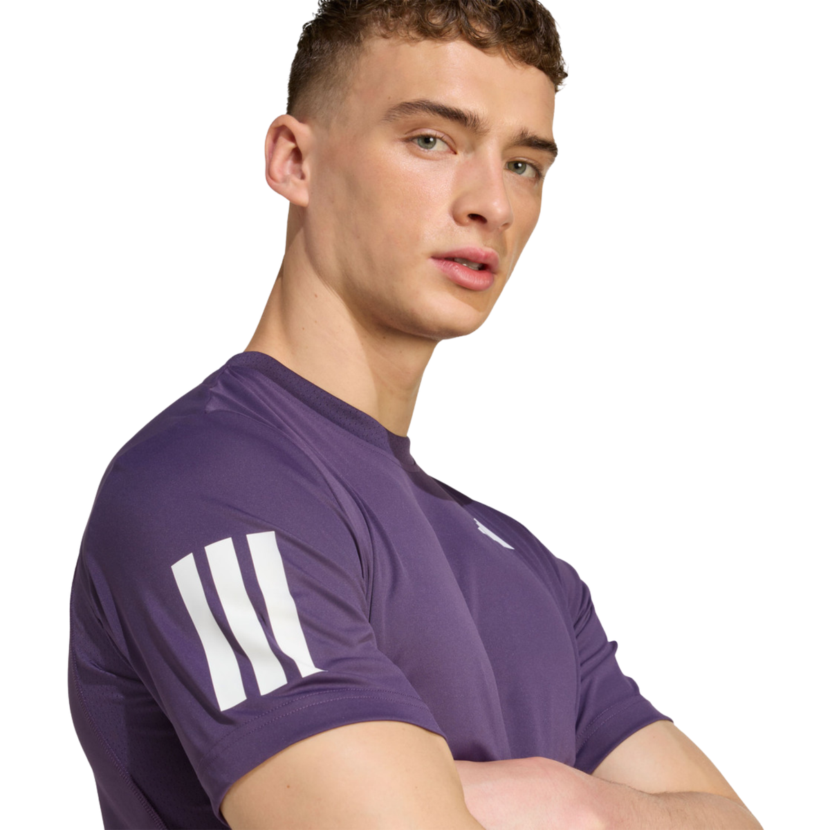 Close-up of a model wearing the purple adidas T-shirt showing the sleeve stripe detail.