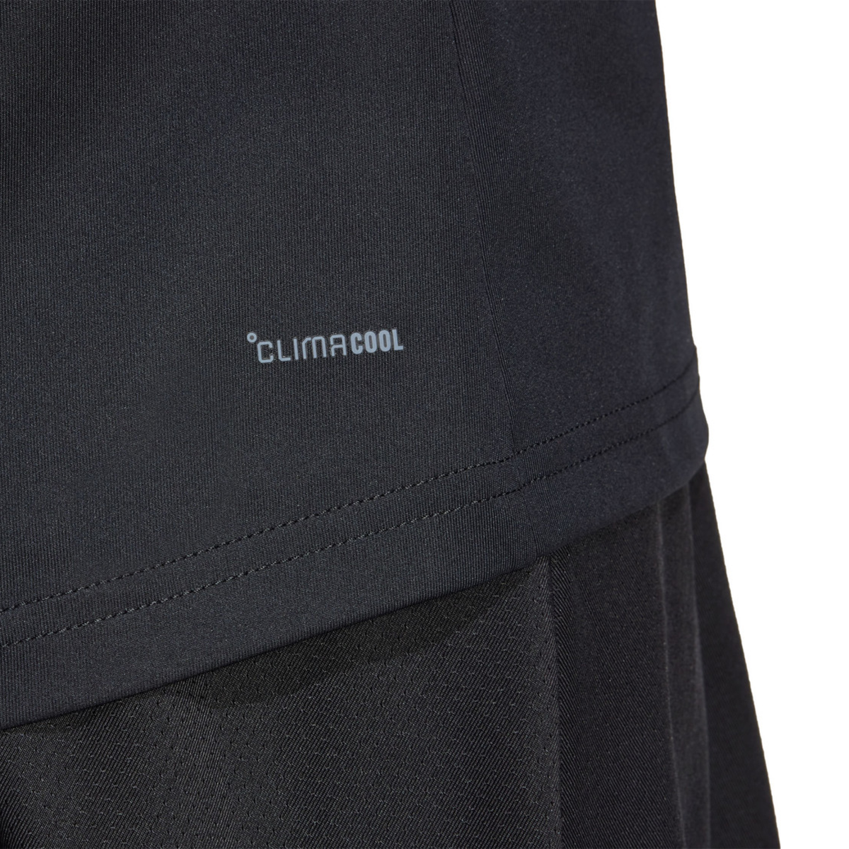 Close-up of the CLIMACOOL fabric detail on the black adidas women's T-shirt.