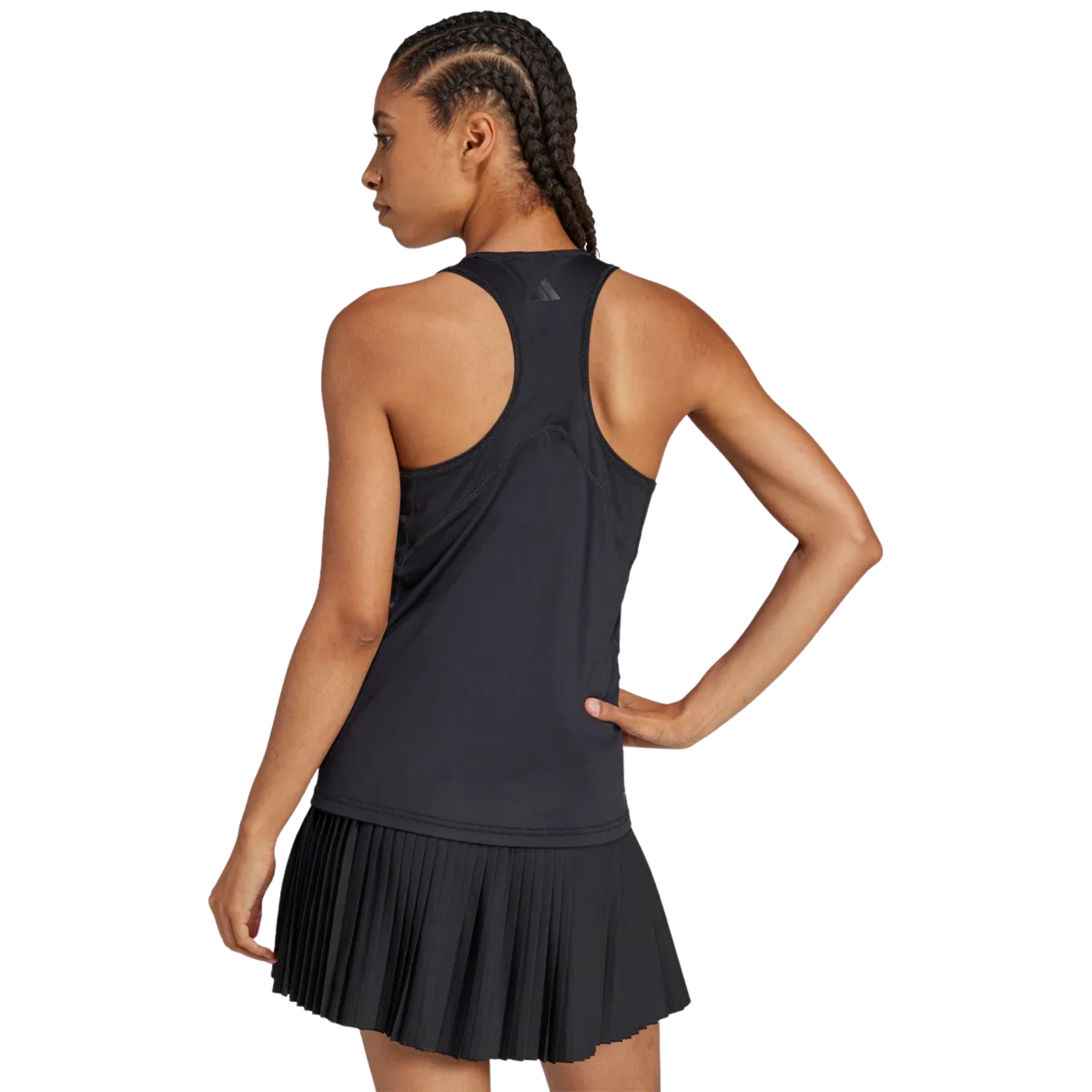 Back view of a model wearing the black adidas women's tank top.