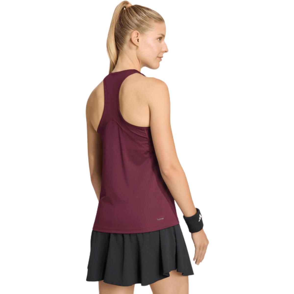 Back view of a model wearing the burgundy Adidas women’s tank top.