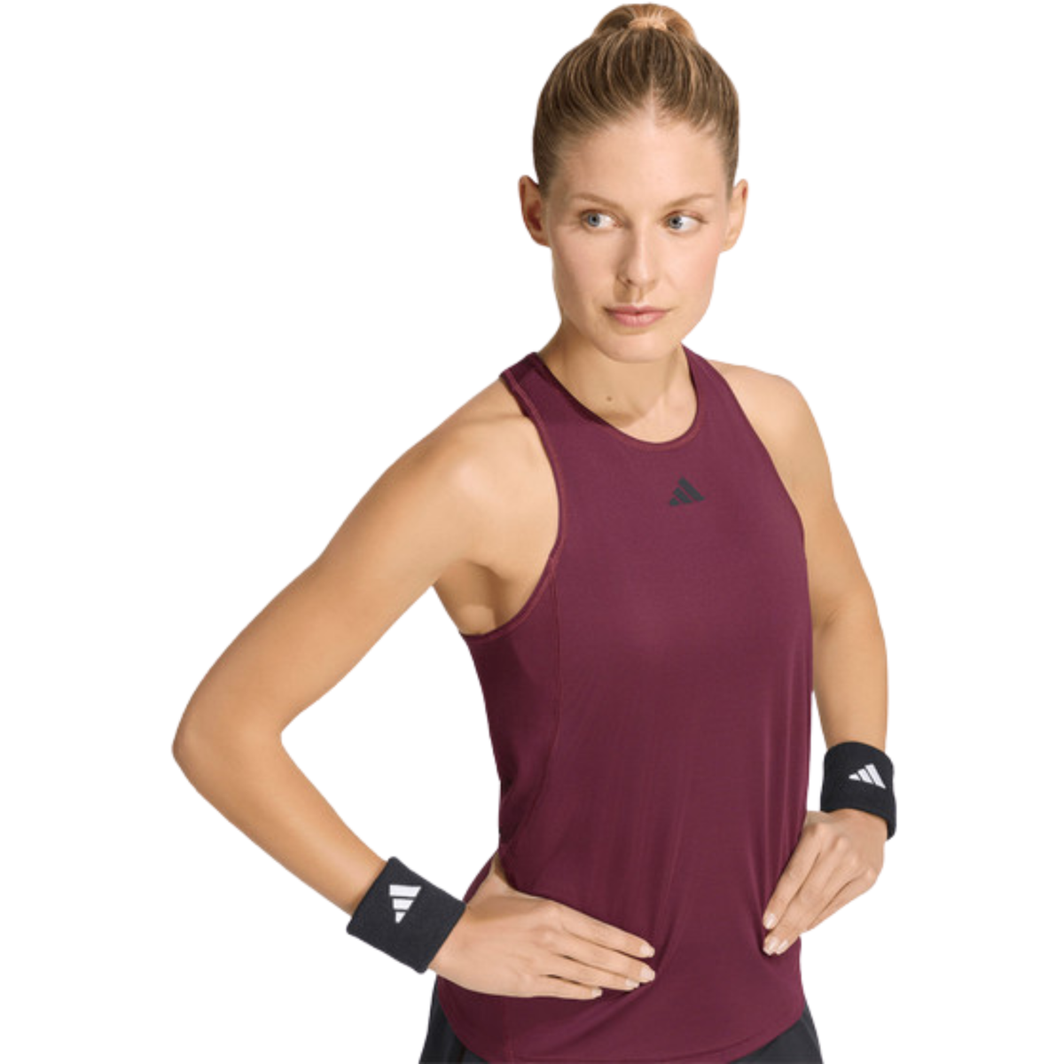 Close-up view of a model wearing the burgundy Adidas women’s tank top.