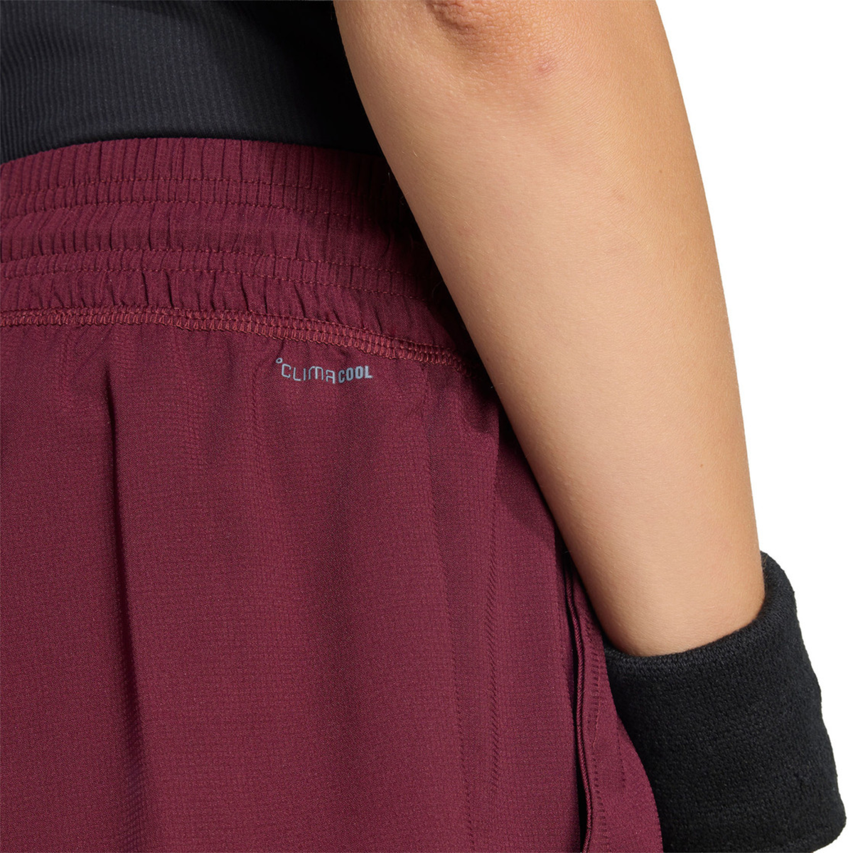 Close-up of the back of the burgundy adidas women's shorts showing the CLIMACOOL detail.