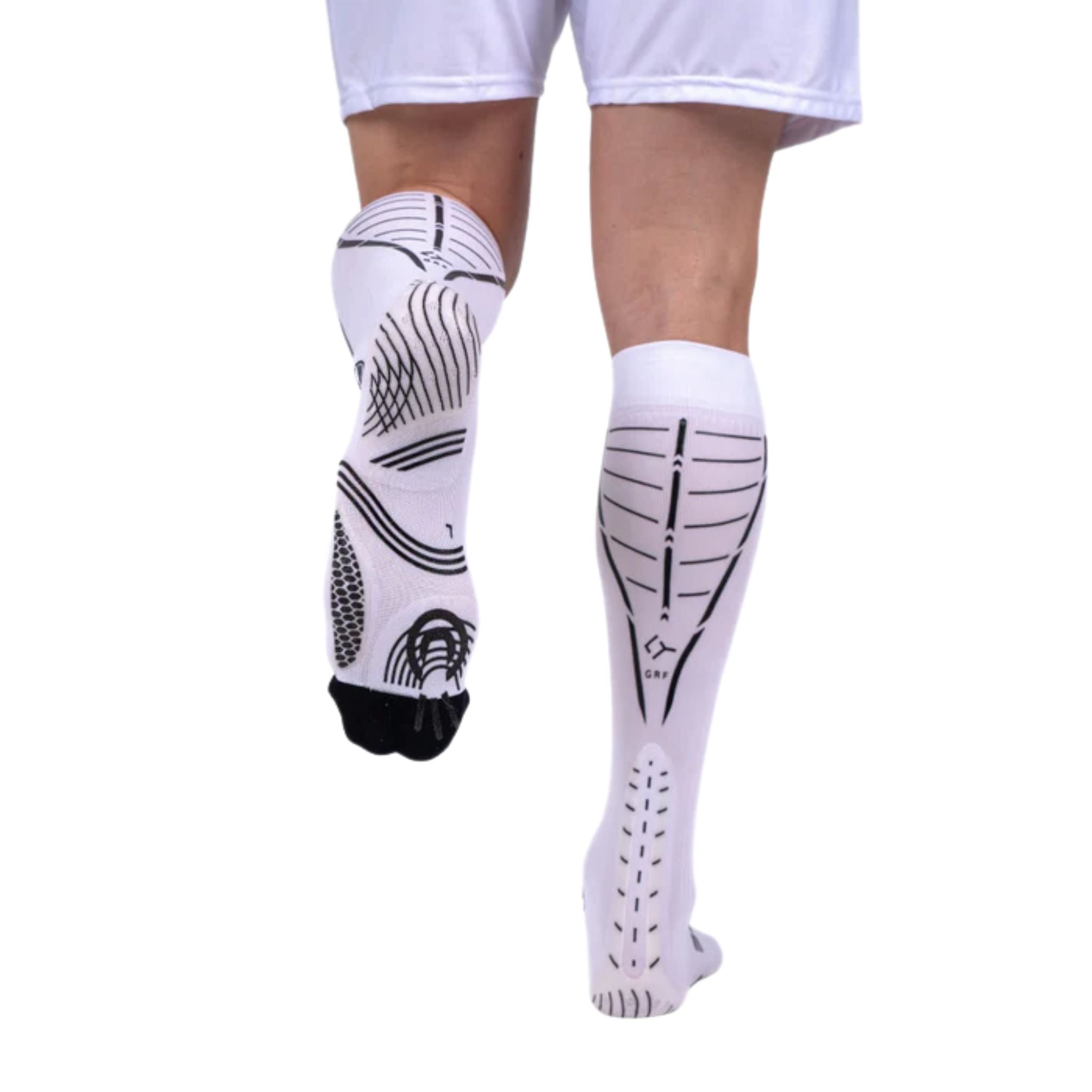 Athlete running while wearing Floky GRF Long Compression Grip Socks White, demonstrating stability, muscle support, and enhanced comfort during high-intensity movement.