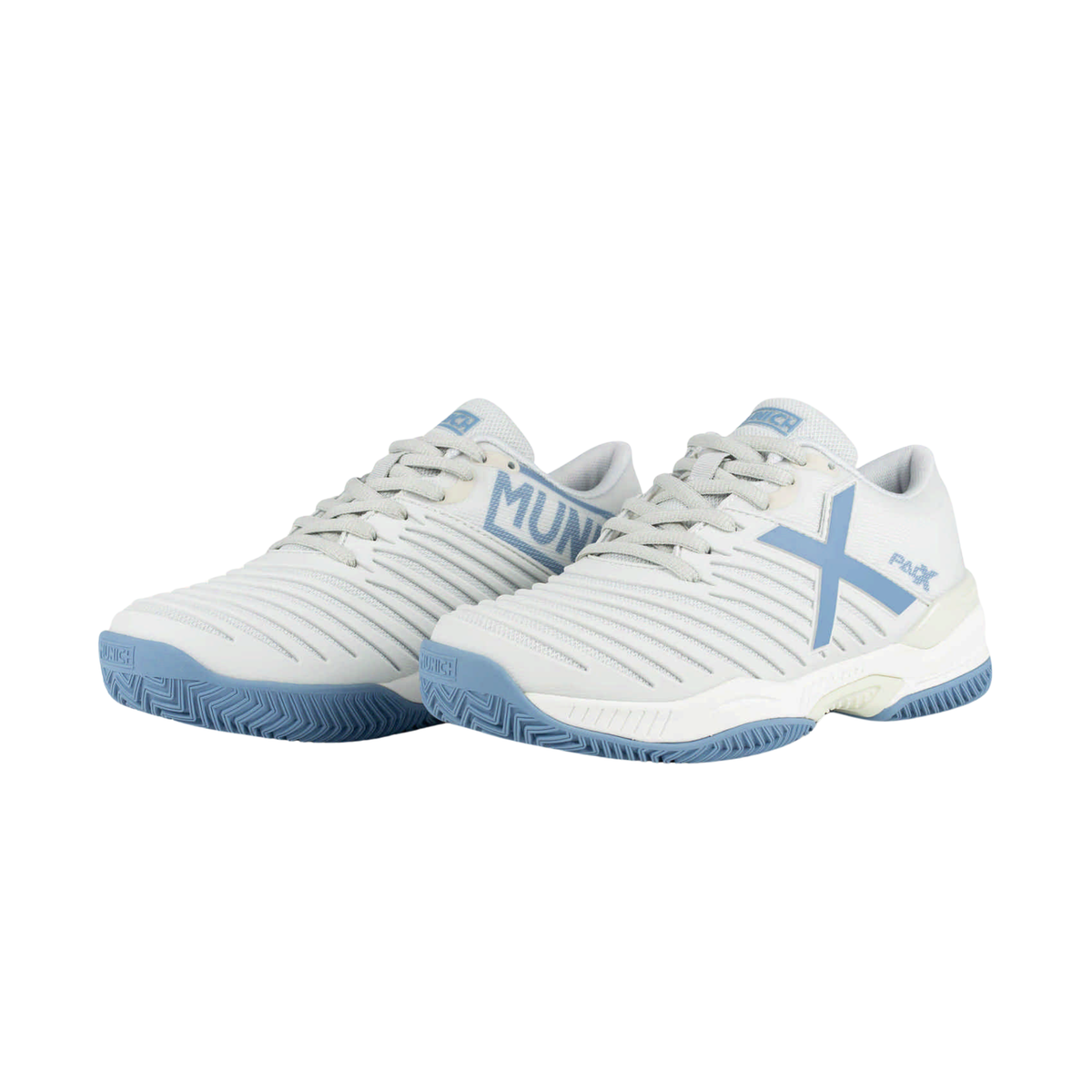 Pair of Munich PADX 69 padel shoes in white and light blue, shown from an angled front view with white laces, ribbed uppers, light blue Munich and X branding, white midsoles and blue outsoles.