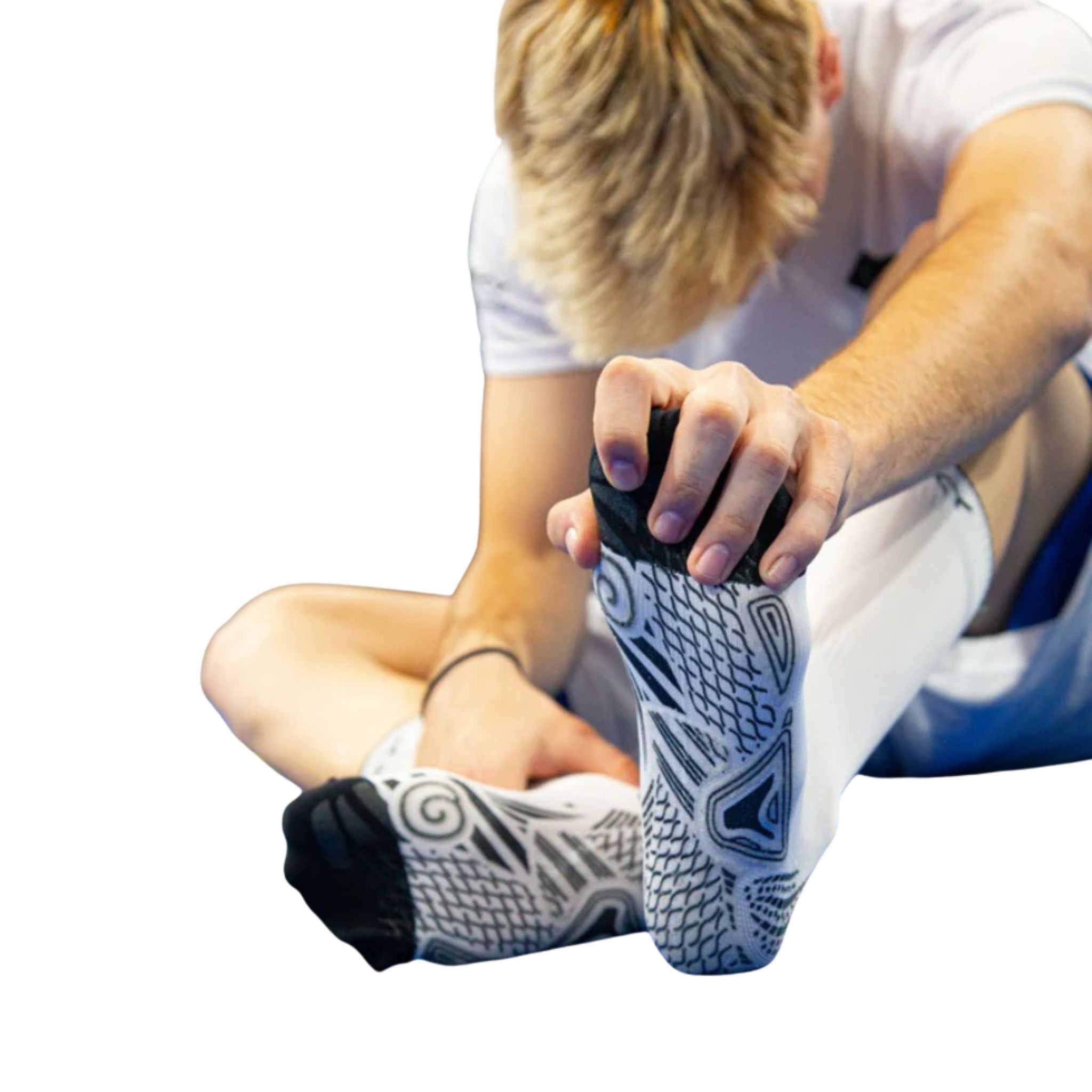 Male athlete wearing Floky S-MASH Grip Socks White (1 Pair), showcasing the secure anti-slip grip and supportive fit for training and competition.