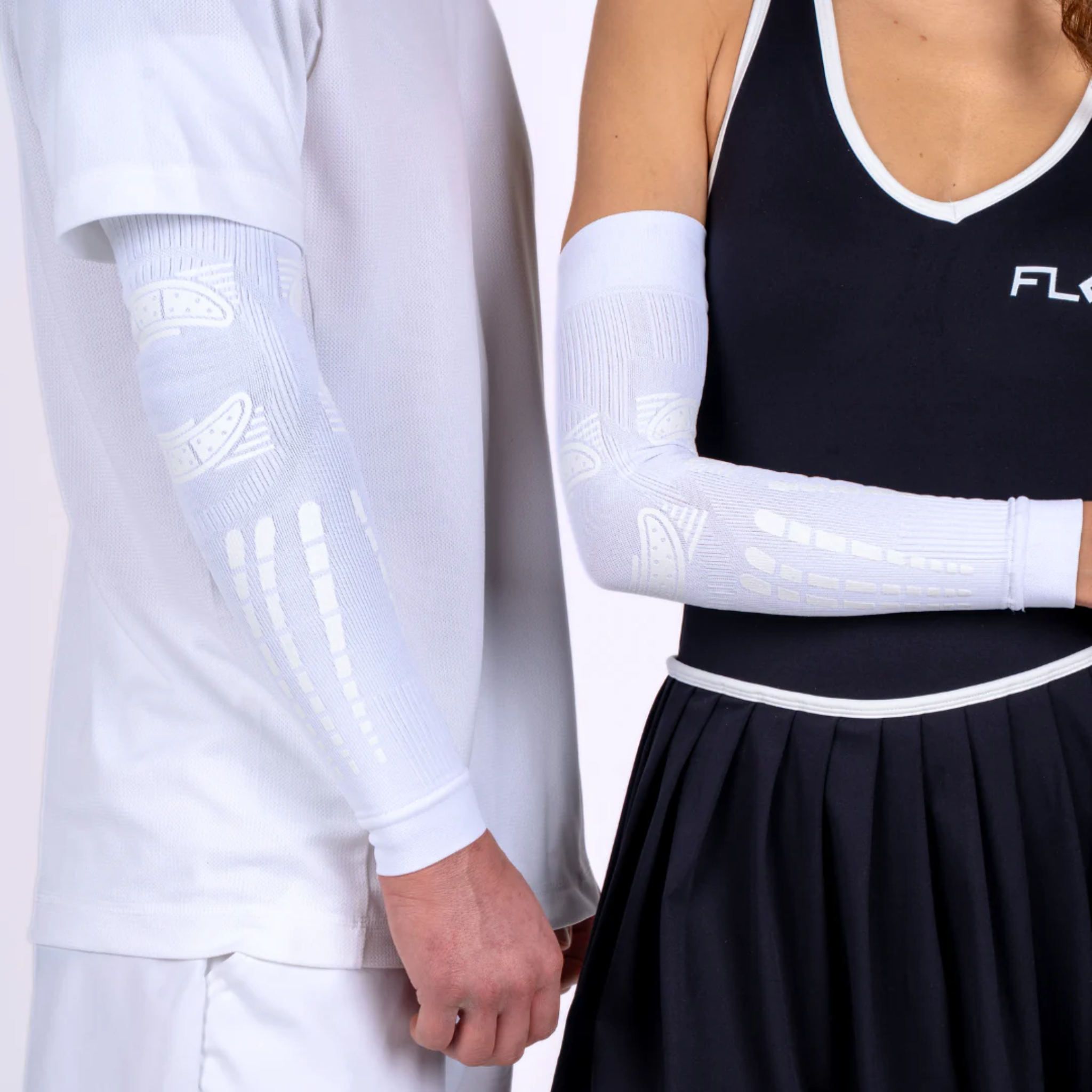 Man and woman wearing Floky Elbow Sleeves White (2 Pieces), showcasing targeted compression support, enhanced elbow stability, and all-day comfort during sports and physical activities.