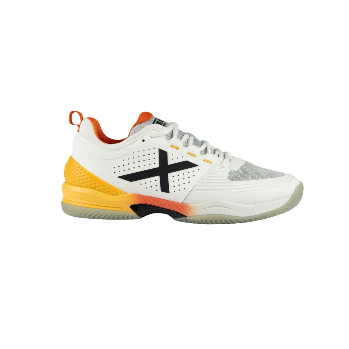 Side view of the Munich Atomik 55 white padel shoe with white laces, large black X logo, perforated side panels, light grey mesh toe section, bright yellow heel support, orange lining and pull tab, orange midsole accent and translucent pale outsole.
