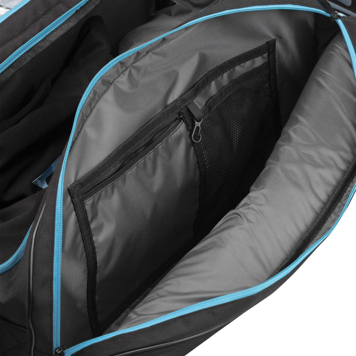 Close-up of the interior lining and storage compartment of the Pallap Mid Racket Bag.
