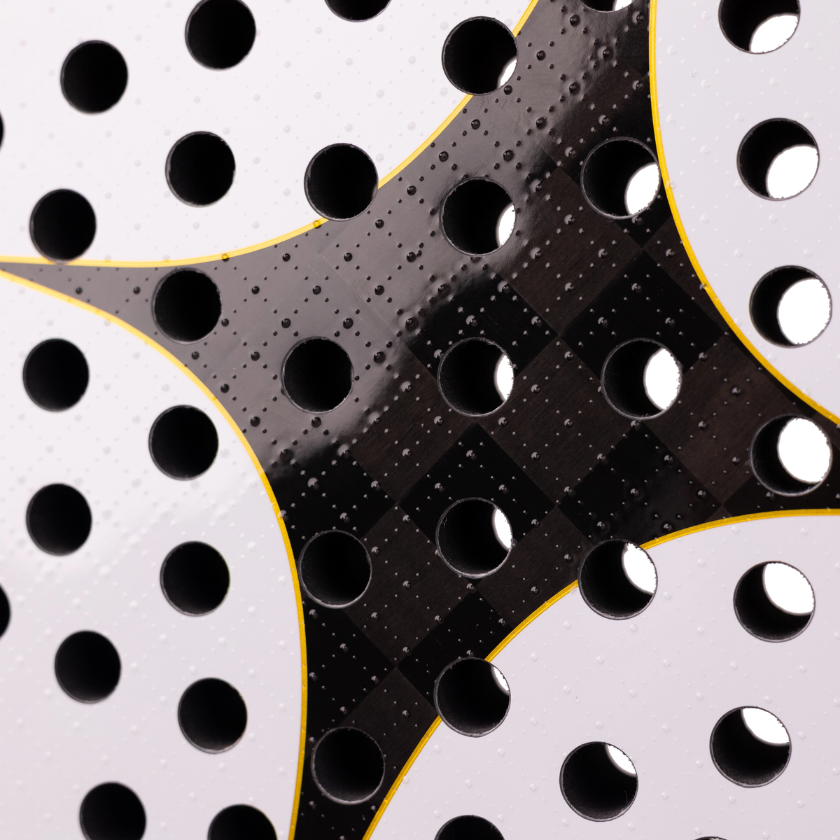 A close-up of the StarVie Eternal by Sanyo Gutiérrez racket face, showing the textured carbon surface, perforations and graphic details.