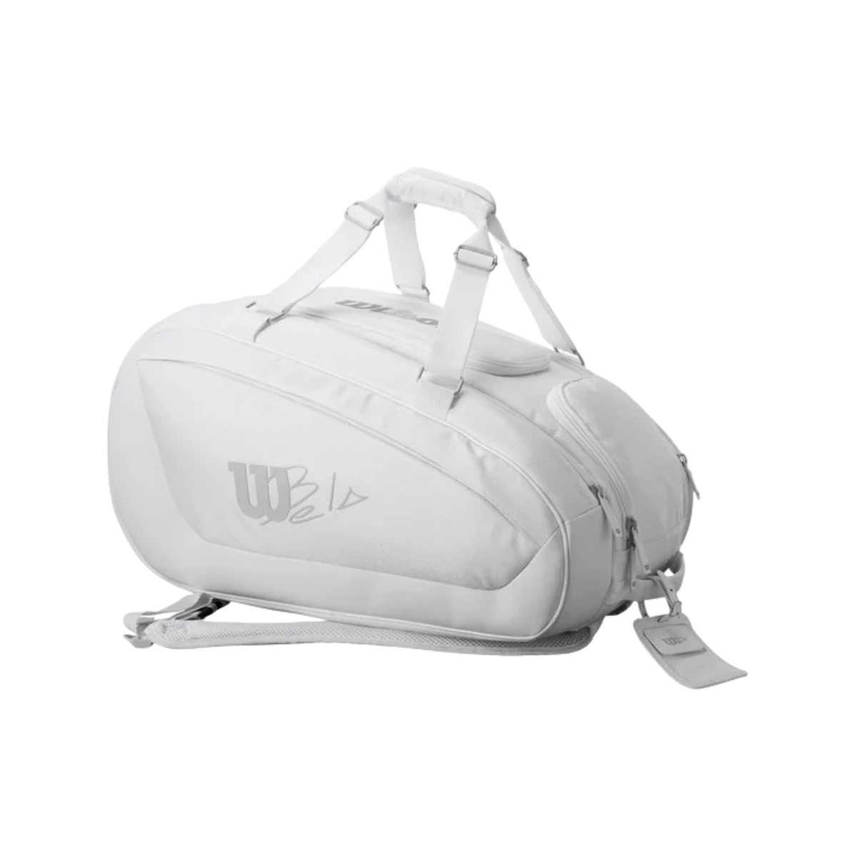 Front angled view of the white Wilson Bela padel bag showing the Bela branding, carrying handles and zippered compartments.