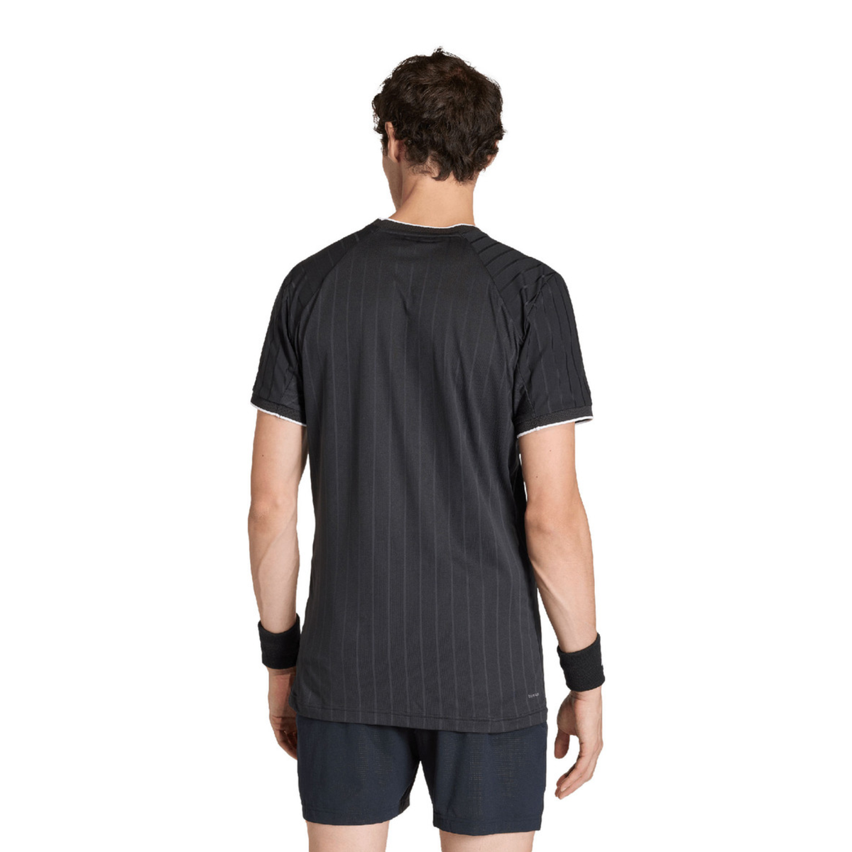 Back view of the adidas Climacool Freelift Pro T-Shirt Black KG6053 worn by a male model, showing the black design with subtle vertical striping and short raglan sleeves.