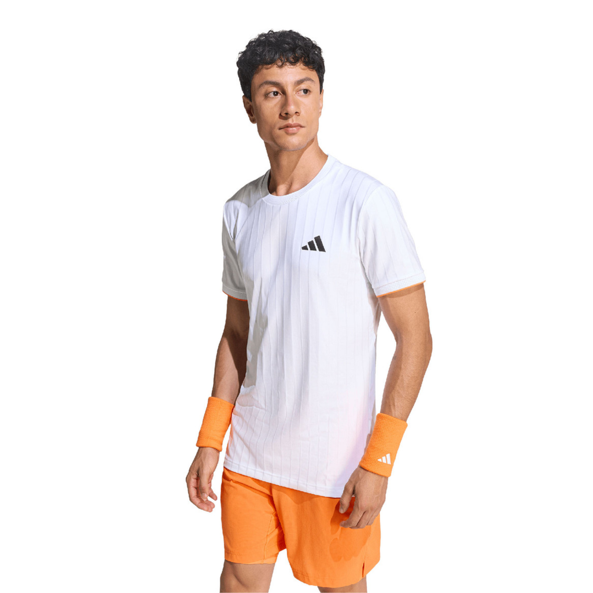 Full-body standing view of a male model wearing the adidas Climacool Freelift Pro T-Shirt White with orange shorts, white socks, white adidas shoes and orange wristbands.