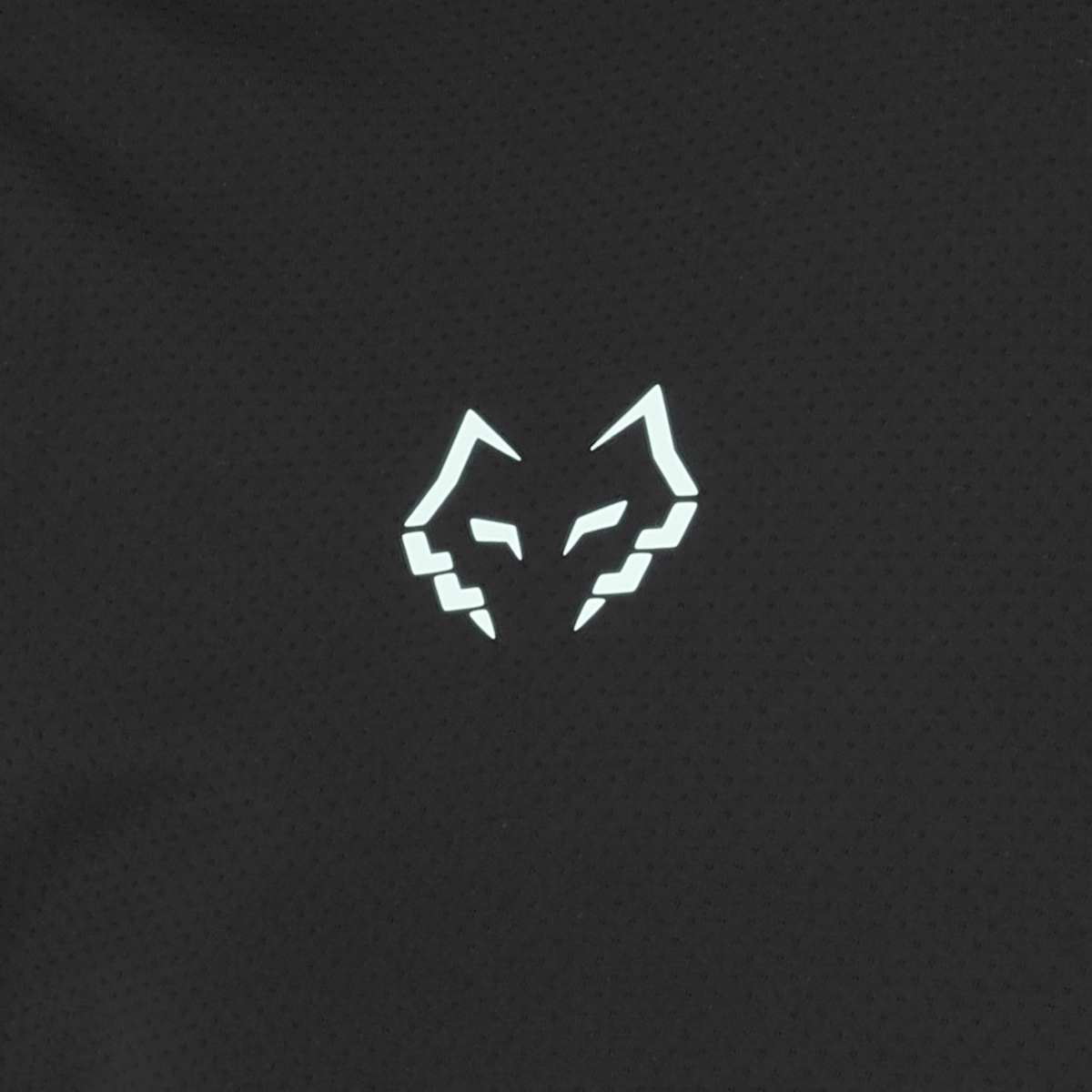 Detailed close-up of the Babolat Crew Neck Tee Lebron Men Black 2027 fabric, showing the breathable textured black material and light blue Juan Lebron wolf logo.