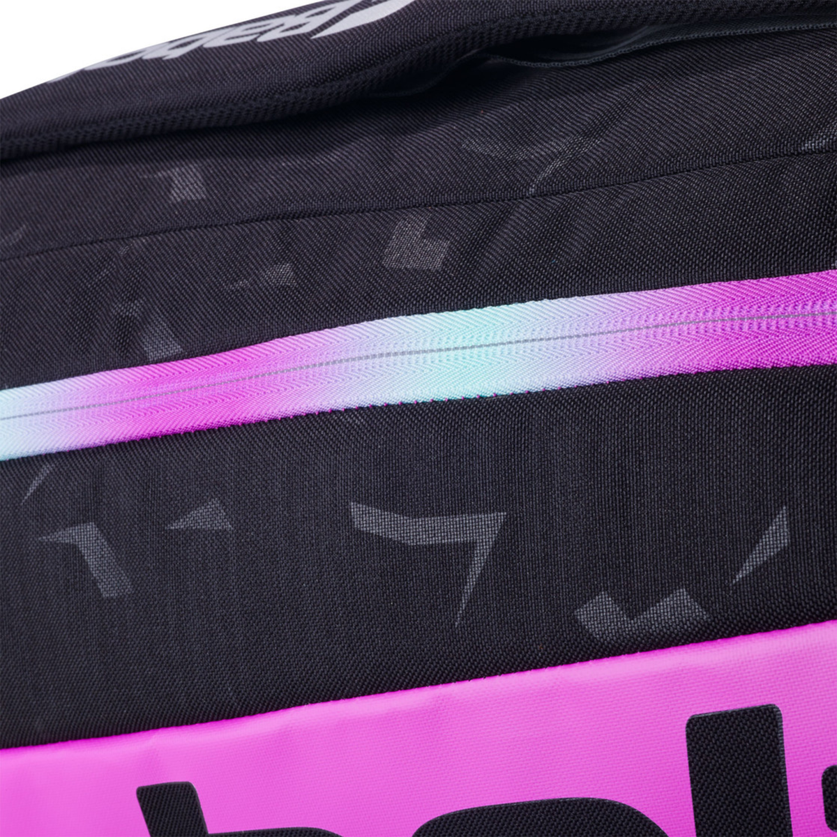 Detailed close-up of the side panel of the Babolat Pro Juan Lebrón Racketbag 2027, showing the black fabric, subtle all-over pattern and pink accent strip.