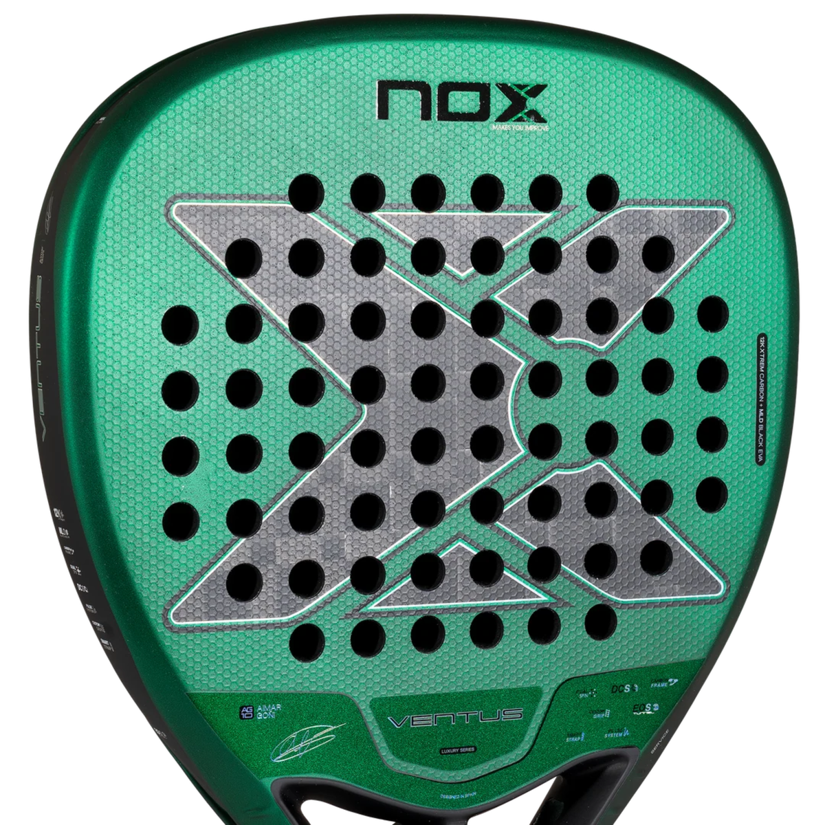 Close-up of the face of the NOX Ventus Attack 12K Xtrem Aimar Goñi 2027 padel racket, showing the perforated surface, grey carbon-style X-shaped pattern, metallic green finish and fine textured surface.