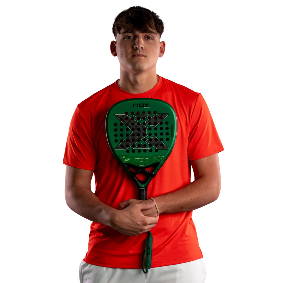 Male padel player wearing a red sports shirt while holding the NOX Ventus Attack 12K Xtrem Aimar Goñi 2027 padel racket in front of him.
