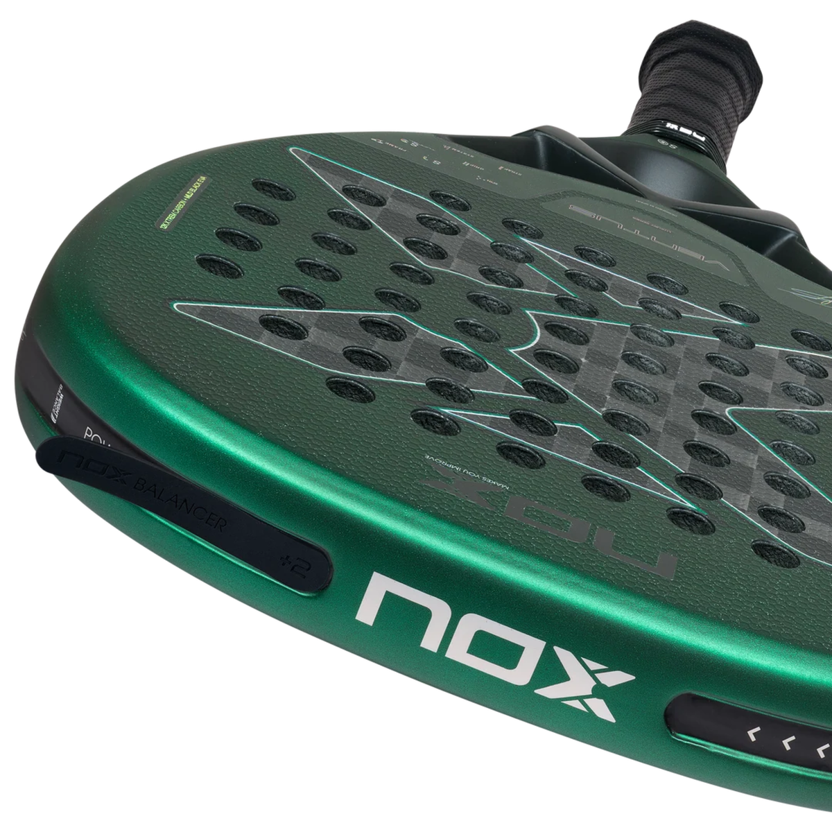 Detailed close-up of the NOX Ventus Attack 12K Xtrem Aimar Goñi 2027 padel racket frame, showing the black Nox Balancer weight system, metallic green frame, white Nox branding and grey carbon-style racket face.